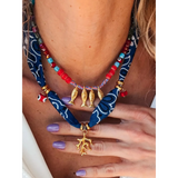 Trendsi resort cruise statement coral necklace with red beads gold fish charms and blue fabric detailing