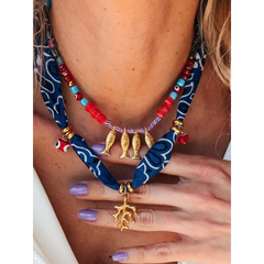 Trendsi resort cruise statement coral necklace with red beads gold fish charms and blue fabric detailing