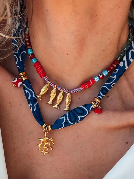 Trendsi resort cruise statement coral necklace with gold fish charms and blue patterned fabric details