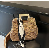 woven straw bag with wooden handles and black white scarf resort wear accessories for women