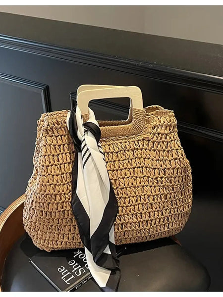 woven straw bag with wooden handles and black white scarf resort wear accessories for women