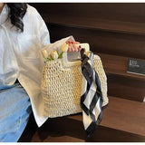 woven bag with wooden handles and black and white scarf, perfect resort wear accessories for women
