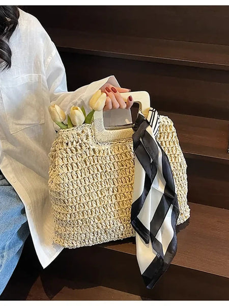 woven bag with wooden handles and black and white scarf, perfect resort wear accessories for women