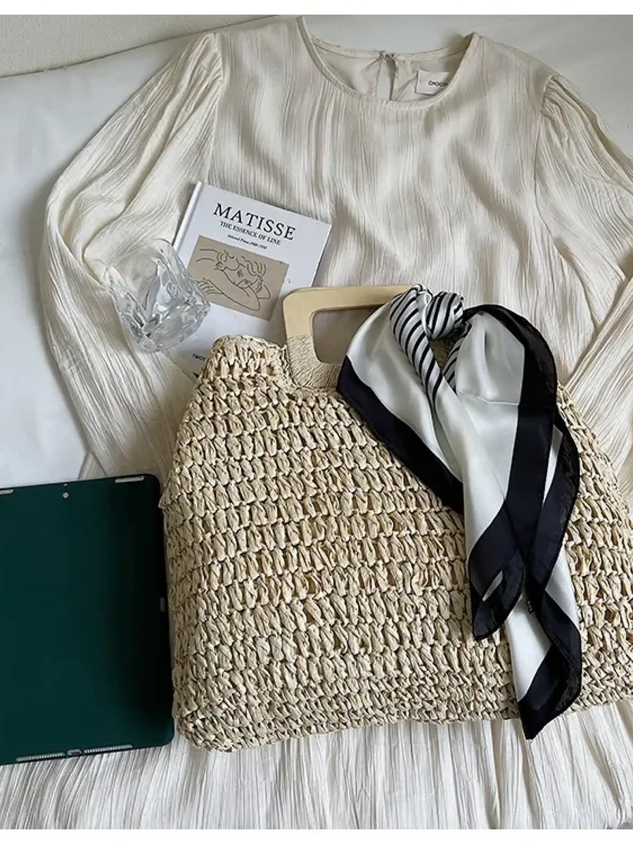 woven bag with black and white scarf on cream dress as resort wear accessories for women