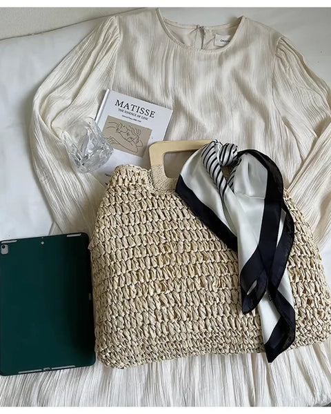 woven bag with black and white scarf on cream dress as resort wear accessories for women