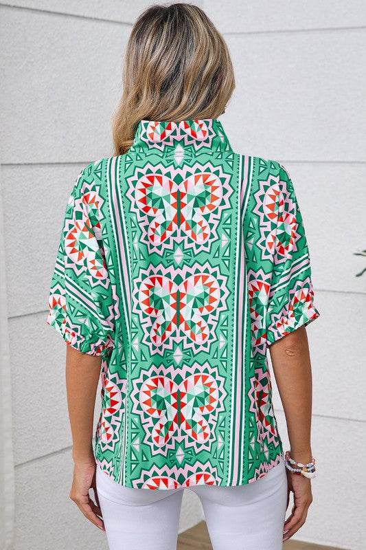 EG fashion resort wear dolman sleeve blouse with colorful geometric butterfly print on green background