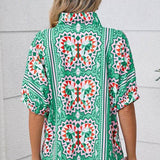 EG fashion resort wear dolman sleeve blouse with colorful geometric butterfly print on green background