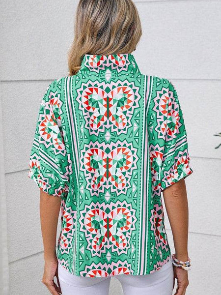 EG fashion resort wear dolman sleeve blouse with colorful geometric butterfly print on green background