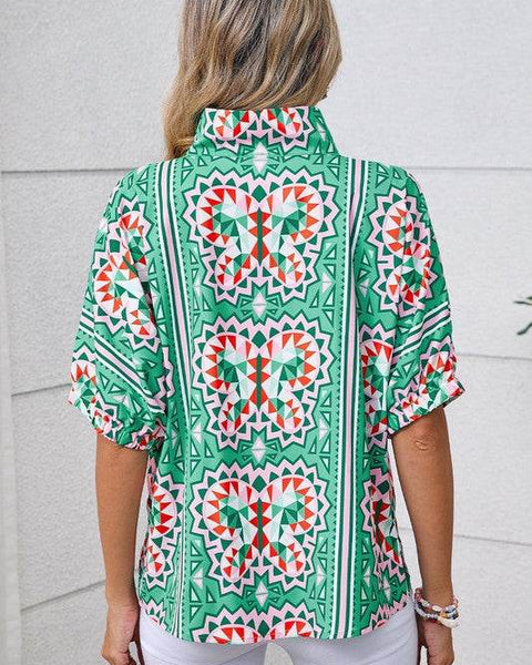 EG fashion resort wear dolman sleeve blouse with colorful geometric butterfly print on green background