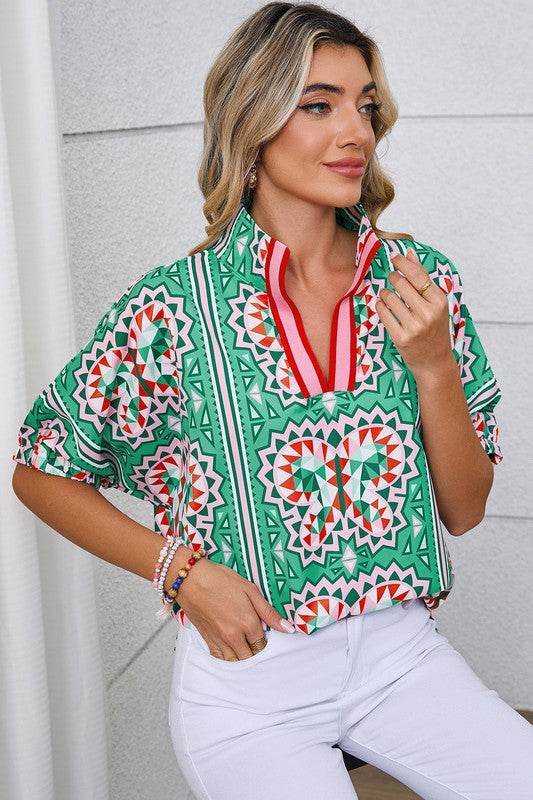 EG fashion resort wear dolman sleeve blouse in green geometric print with red accents