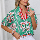 EG fashion resort wear dolman sleeve blouse in green geometric print with red accents