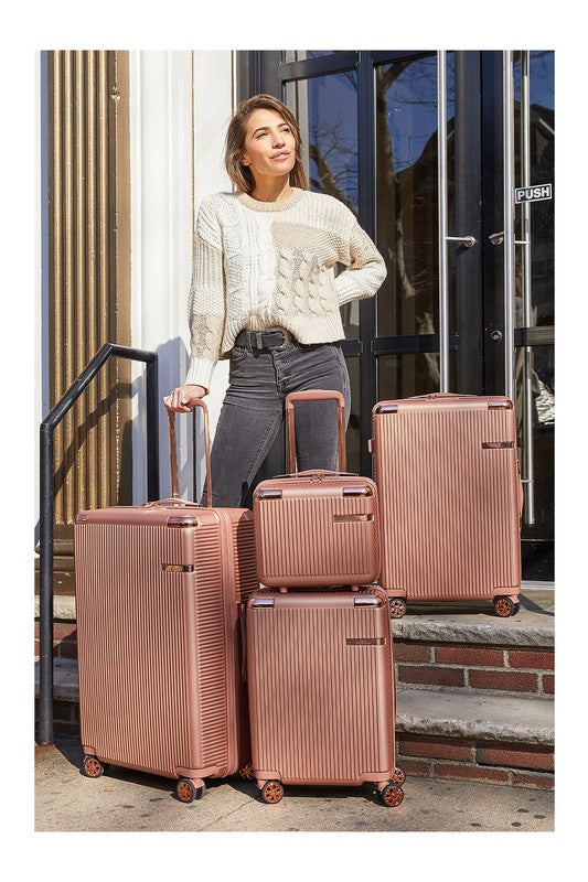 Rose Gold 4 piece travel suitcase set with textured design and spinner wheels by Babe Beachwear