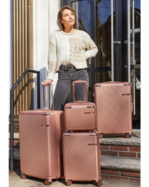 Rose Gold 4 piece travel suitcase set with textured design and spinner wheels by Babe Beachwear