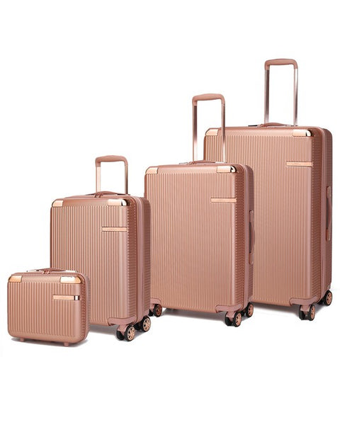 Rose Gold 4 piece travel suitcase set by Babe Beachwear with hard shell and spinner wheels