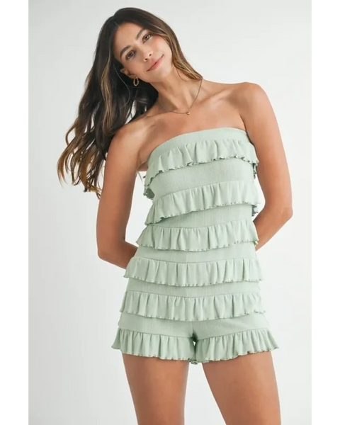 Trendsi light green ruffled tube romper with layered fabric details worn by model