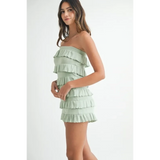 Trendsi ruffled tube romper in light green with layered ruffle details on a female model
