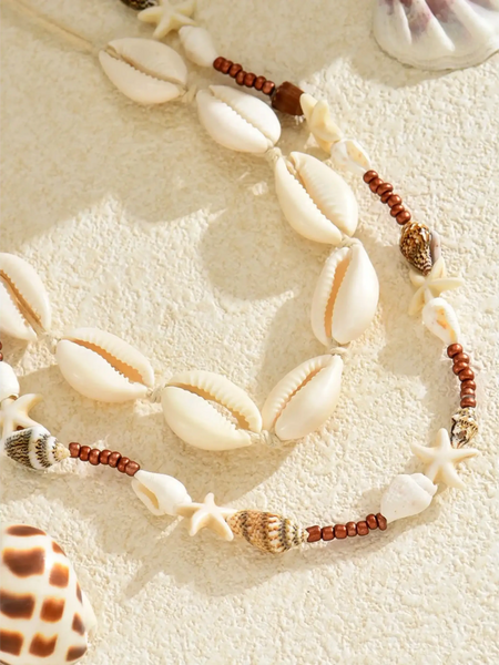 Trendsi seashell layered necklace for beach with natural shells and wooden beads on sand