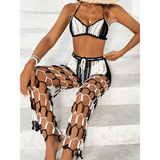 Beach Babes sexy bikini set for women with black and white crochet top and matching netted pants sitting