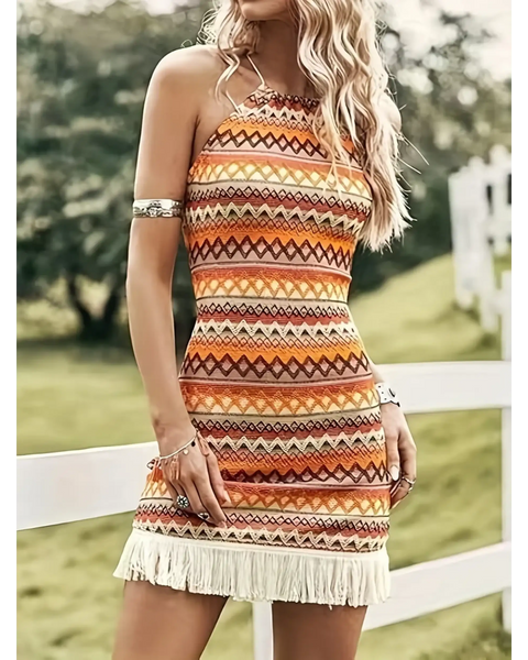 Trendsi Sexy Boho Beach Mini Dress with colorful tribal pattern and fringe hem worn outdoors