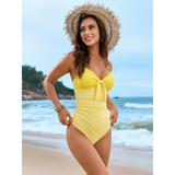 Beach Babes yellow sexy one-piece bathing suit with front tie detail worn on the beach