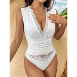 Babe Beachwear white lace sexy summer vacation bodysuit with deep V-neck and sheer details