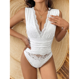 Babe Beachwear sexy summer vacation bodysuit in white lace with deep neckline and sleeveless design