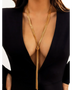 Trendsi sexy twisted long tassel necklace in gold worn with a deep V-neck black dress