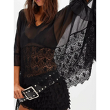 Babe Beachwear black coverup featuring sheer lace summer beachwear design with ruffled sleeves and delicate lace details