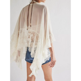 Babe Beachwear sheer lace summer beachwear coverup in white with delicate lace trim over denim shorts