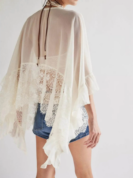 Babe Beachwear sheer lace summer beachwear coverup in white with delicate lace trim over denim shorts