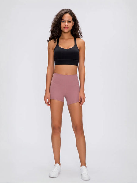 Woman in stylish stitch active shorts ready to crush her workout