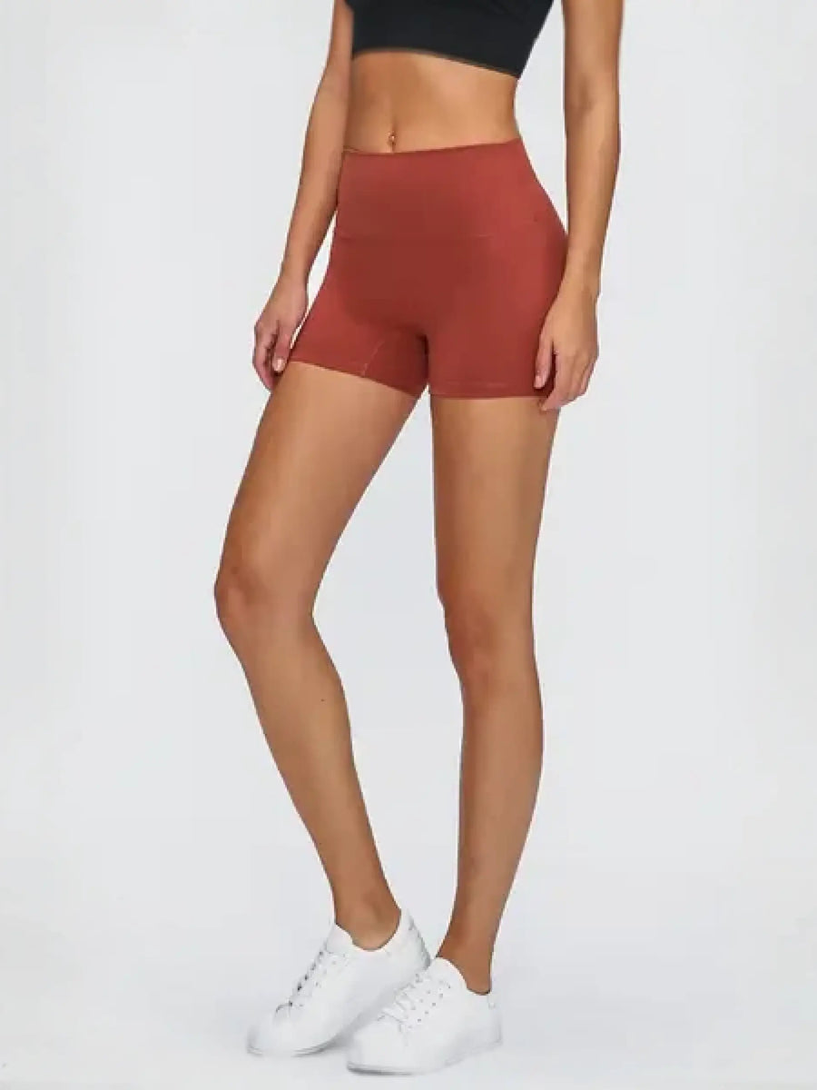 Woman in stylish stitch active shorts crushing her workout during exercise