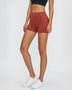 Woman in stylish stitch active shorts crushing her workout during exercise
