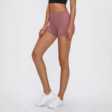 Woman wearing mauve stitch active shorts from Crush Your Workout in Stylish Stitch Active Shorts