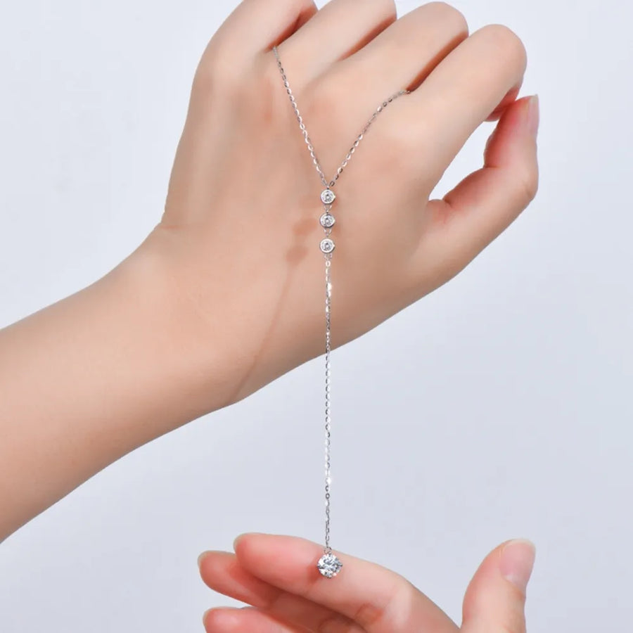 1.3 carat drop necklace with delicate chain and sparkling stones held in hand by Babe Beachwaer