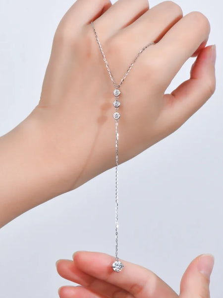 1.3 carat drop necklace with delicate chain and sparkling stones held in hand by Babe Beachwaer