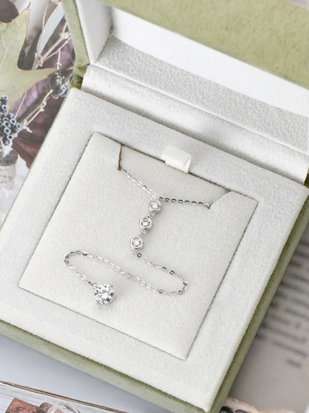 1.3 carat drop necklace with delicate silver chain displayed in a light green jewelry box