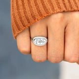  silver women's summer statement ring with floral engraving worn on finger