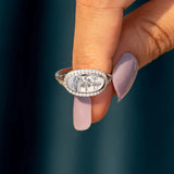 women's summer statement ring with floral design and rhinestone border on silver band