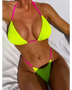 Beach Babes skimpy neon bikini set in bright yellow and pink with ribbed texture on woman lying down