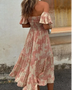 Trendsi smocked off shoulder midi dress with pink floral patterns and ruffled hem on model