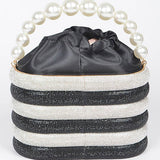 Artini Accessories Sparkle Striped Bucket Bag with Gold Detail featuring black and white stripes and pearl handle