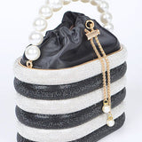 Sparkle Striped Bucket Bag with Gold Detail featuring black and white stripes and a pearl handle