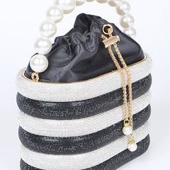 Sparkle Striped Bucket Bag with Gold Detail featuring black and white stripes and a pearl handle