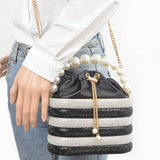 Sparkle Striped Bucket Bag with Gold Detail by Artini Accessories featuring black and white stripes and pearl handle