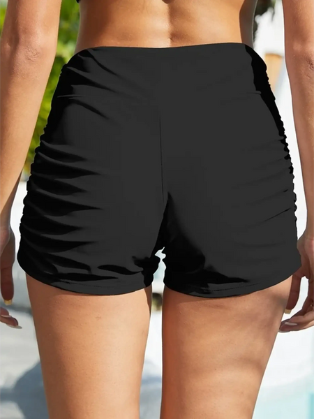 Black sporty swim shorts for women by Beach Babes with ruched sides ideal for active beachwear