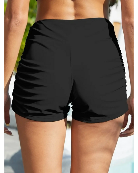 Black sporty swim shorts for women by Beach Babes with ruched sides ideal for active beachwear