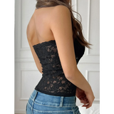 Babe Beachwear black strapless lace crop top worn by woman with blue jeans from the back