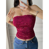 Babe Beachwear strapless lace crop top in deep red worn with blue jeans
