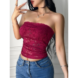 Babe Beachwaer strapless lace crop top in deep red worn with blue jeans